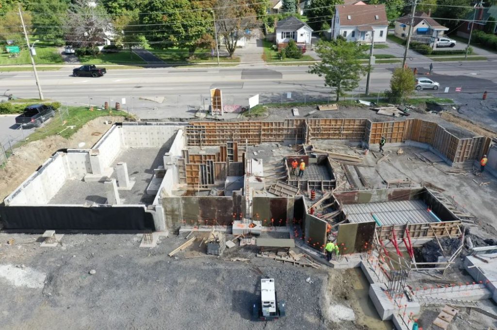 Kingston & Frontenac Housing Apartment Building Buttcon